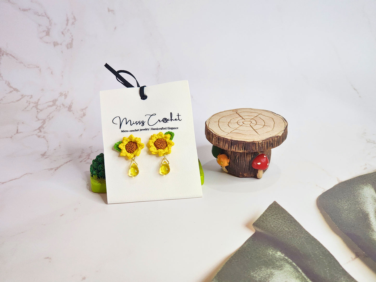 Handcrafted micro-crochet sunflower with Miyuki waterdrop glass beads. 18K gold-plated studs