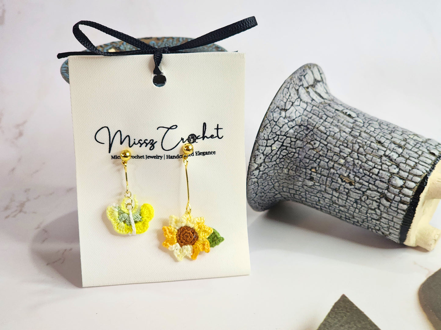 Handcrafted micro-crochet sunflower & butterfly asymmetrical earrings. 18K gold-plated findings & studs.