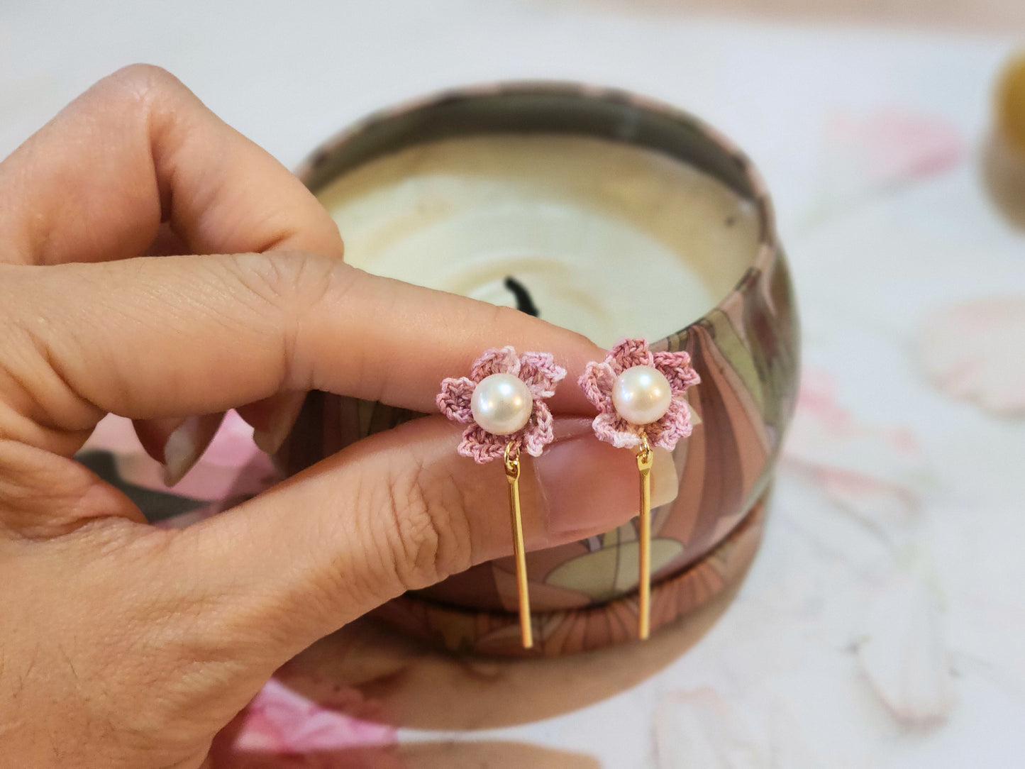 Handcrafted micro-crochet Sakura with pearls earrings. Adorned with 7-8mm nearly round, flawless natural freshwater pearls. 18K gold-plated studs.