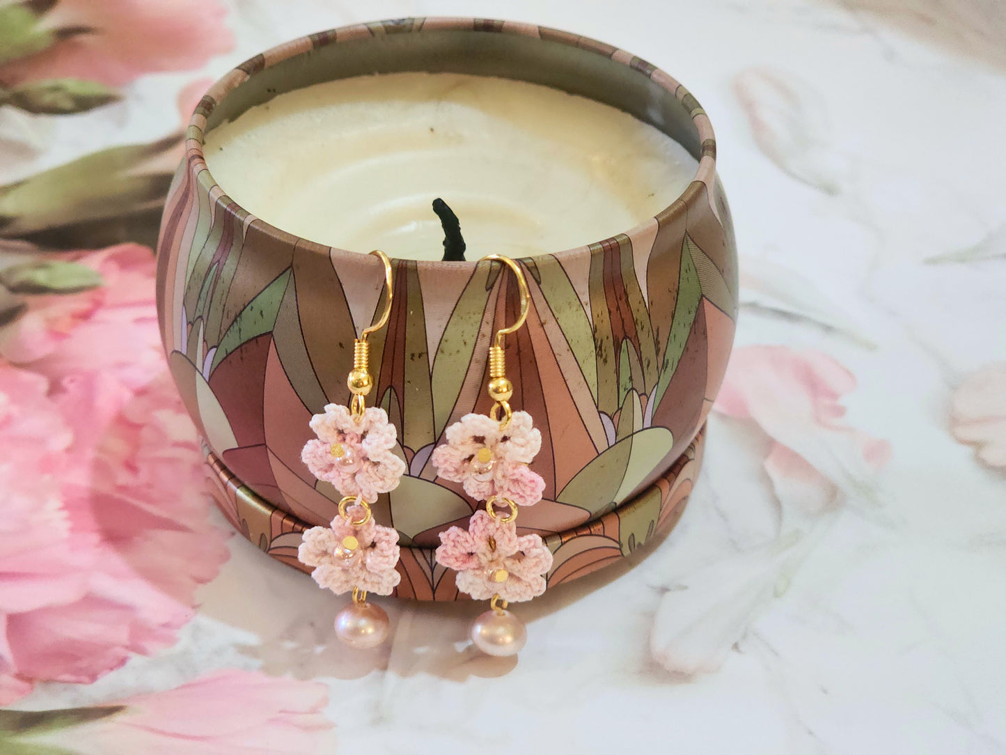 Handcrafted micro-crochet Sakura blossoms paired with lustrous, pink 6-7mm natural freshwater pearls and Miyuki waterdrop glass beads from Japan.