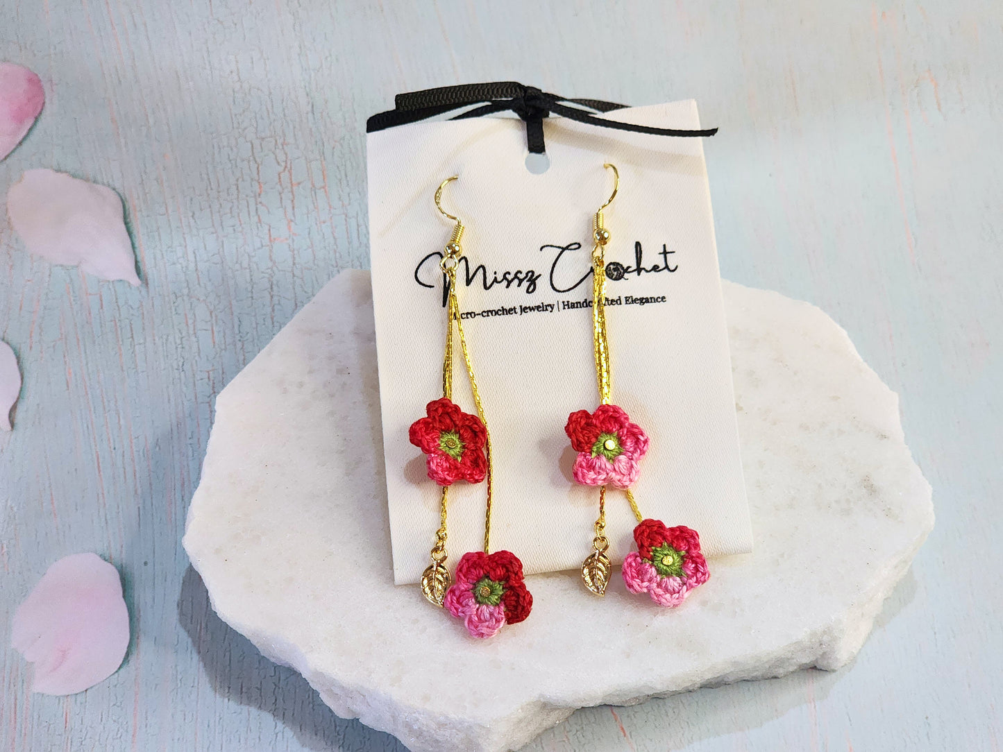 Handcrafted cascading micro-crochet apple blossoms chandelier earrings. 18K gold-plated enamel leaves & ear hooks.