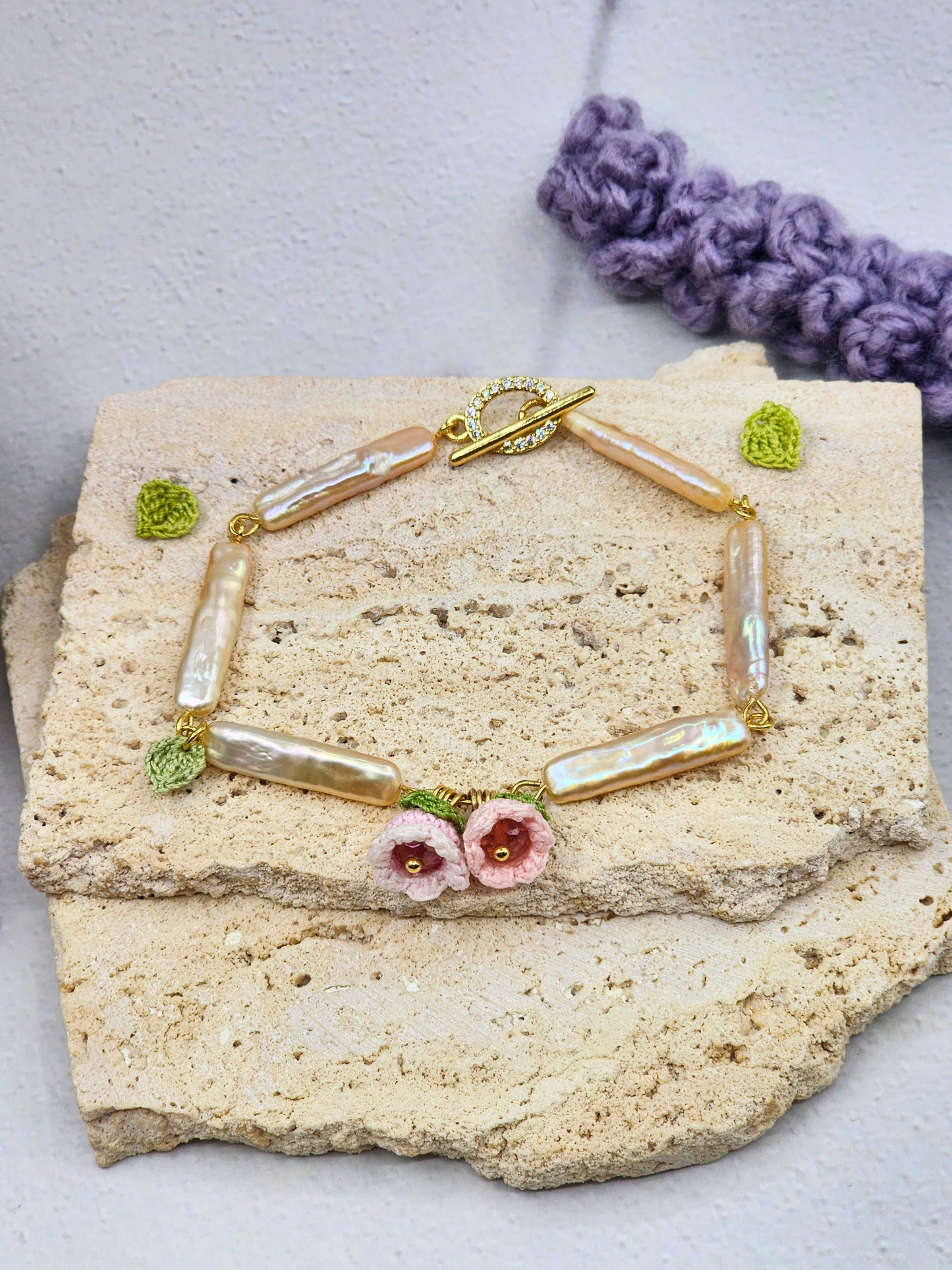 Handcrafted micro crochet Lily of the Valley blooms paired with pink-gold metallic Pipa pearls bracelet