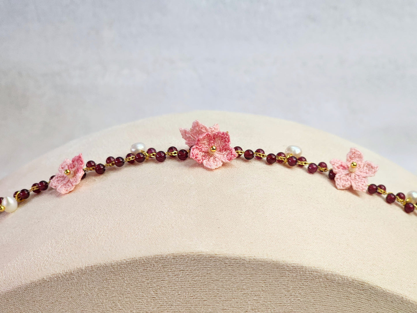 Natural red garnet crystals and pearls bracelet with handcrafted micro-crochet peach blossoms on 18K gold-plated bracelet