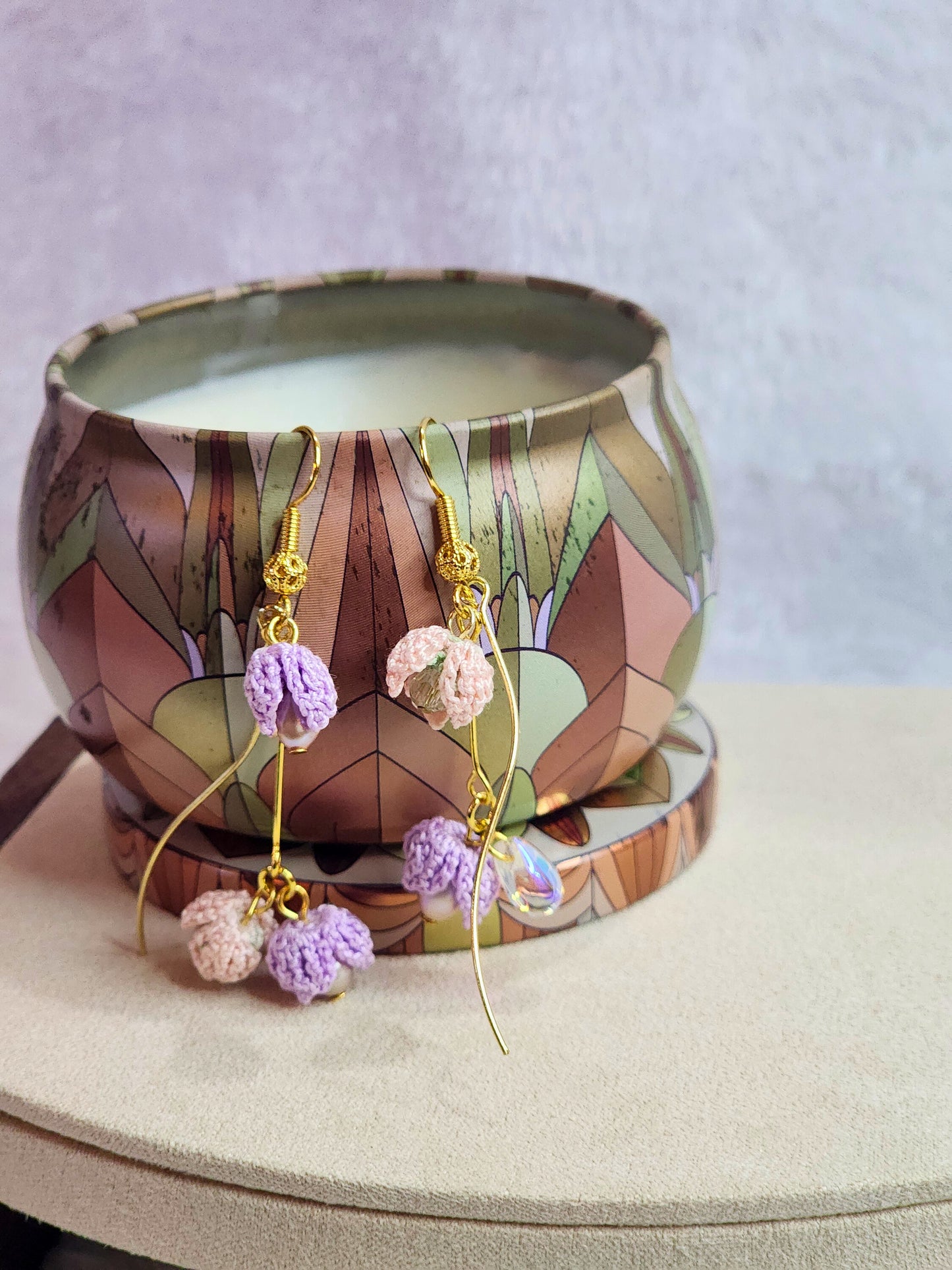 Handcrafted trio of pink & purple micro-crochet snowdrops and 4-5mm purple rice pearls with a mix of premium crystals and glass beads. 18K gold-plated findings and hooks.