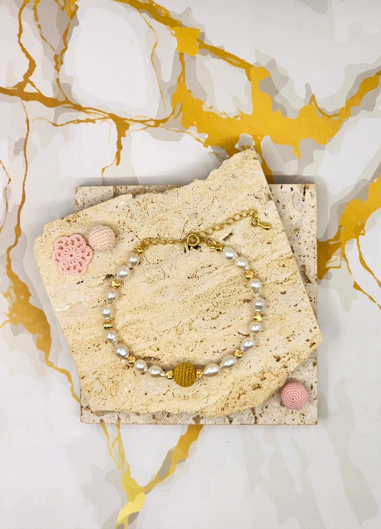 Handcrafted “gold crochet pearl” bracelet inspired by luminous South Sea pearls. Beautifully framed by 5–6mm high lustre, flawless teardrop-shaped pearls. Styled with 18K gold-plated bead accents and clasp.