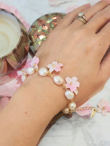 Natural 8-9mm Baroque Pearls bracelet with handcrafted micro-crochet Sakura blossoms. 18K gold-plated adjustable bracelet.