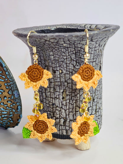 Handcrafted micro-crochet orange sunflowers duo with cascade of Miyuki waterdrop glass beads. 14K gold-plated ear hooks.
