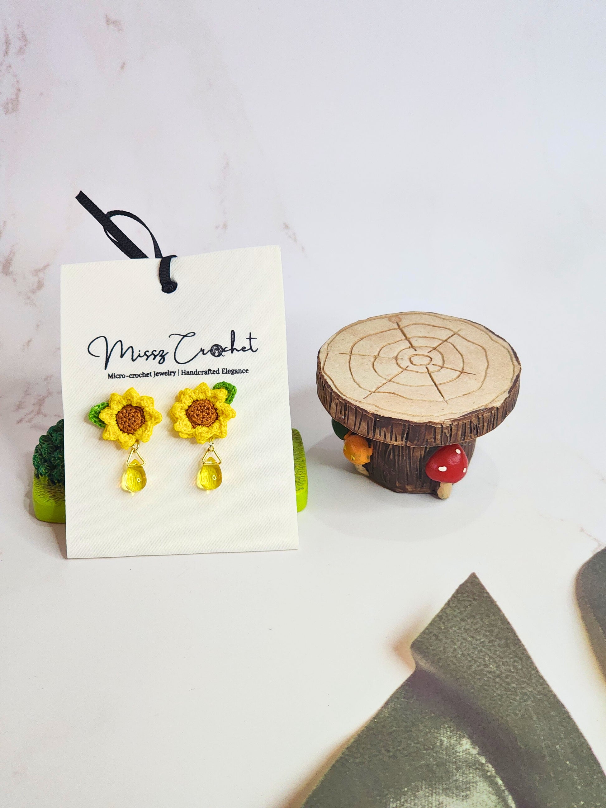 Handcrafted micro-crochet sunflower with Miyuki waterdrop glass beads. 18K gold-plated studs 