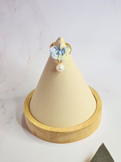 Handcrafted micro-crochet ombre Butterfly Ring with 8-9mm nearly round freshwater pearl. On 14K gold-plated ring.