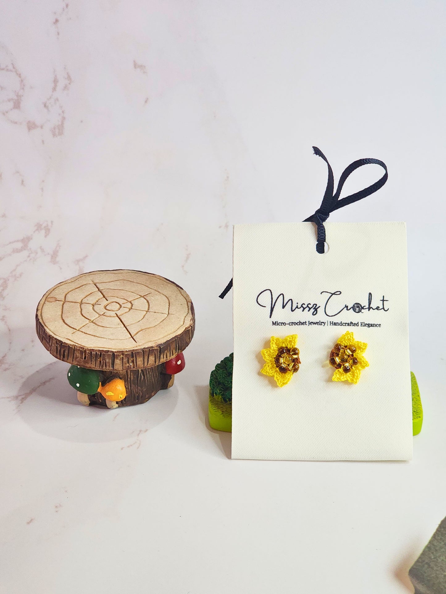 Handcrafted micro-crochet half sunflower earrings with Miyuki waterdrop glass beads. On 18K gold-plated studs. 