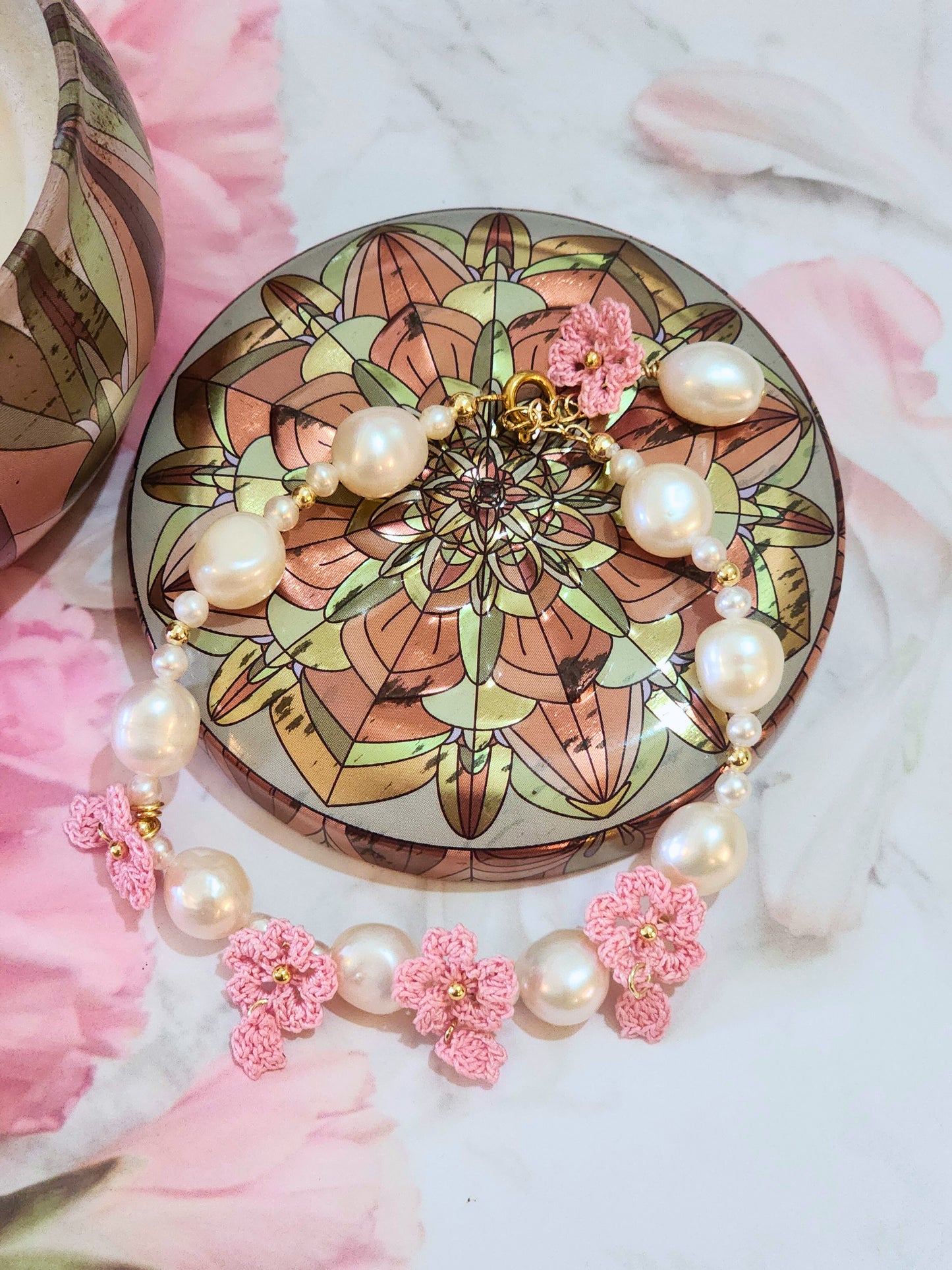 Natural 8-9mm Baroque Pearls with pink micro-crochet Sakura blossoms. Set with 18K gold-plated extension chain.