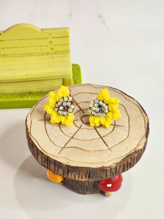 Handcrafted micro-crochet half sunflower with Czech glass beads at its heart. 18K gold-plated studs. 