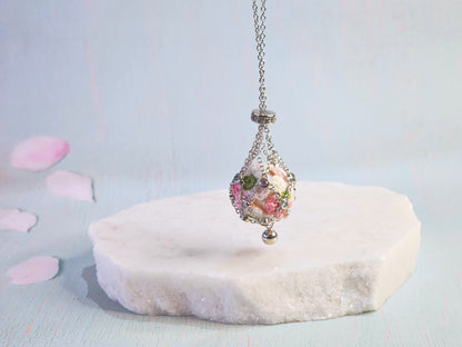 Dreamcatcher necklace with handcrafted micro-crochet apple blossom 'pearl'. S925 sweater chain with cubic zirconia.