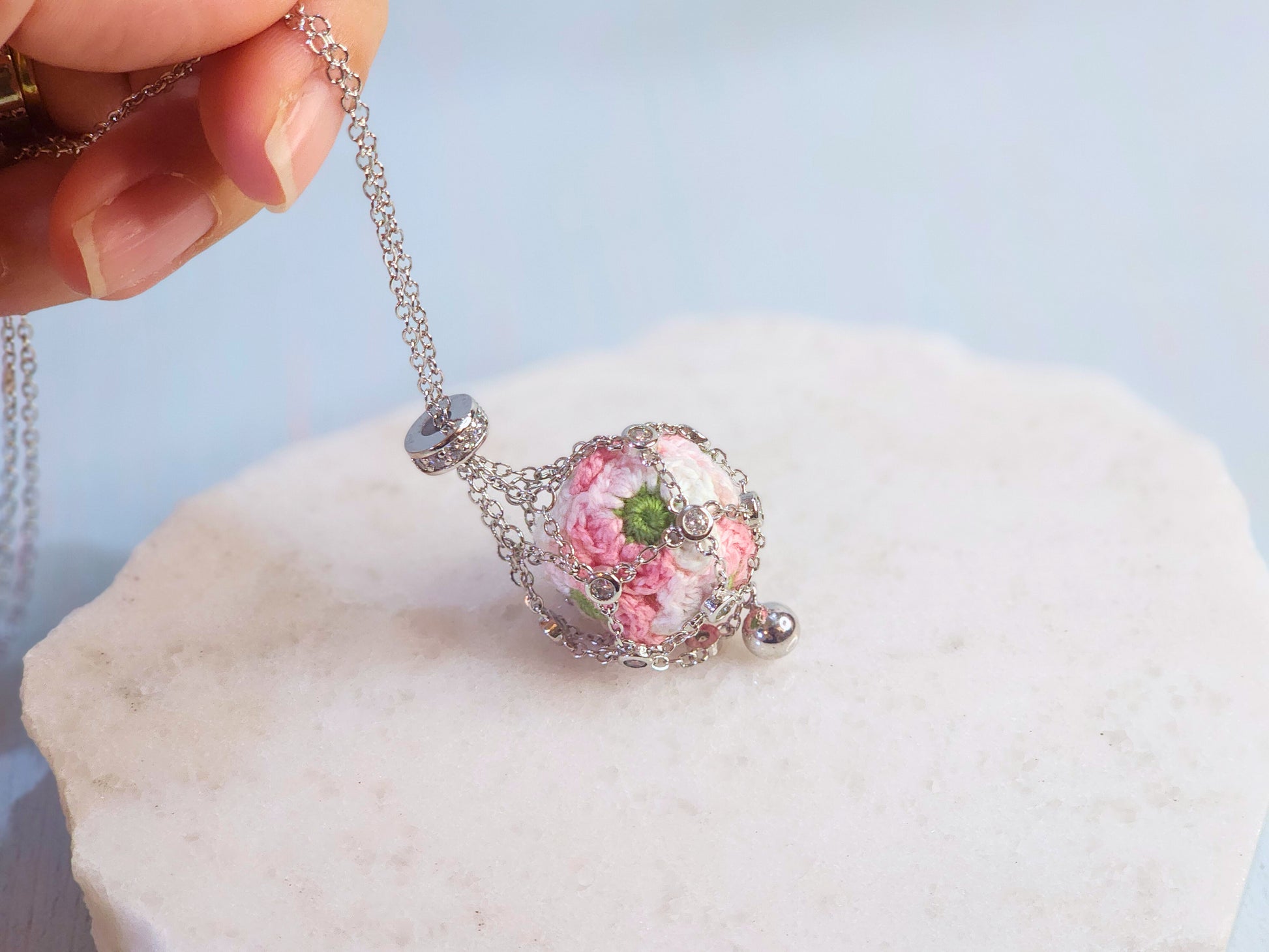 Dreamcatcher necklace with handcrafted micro-crochet apple blossom 'pearl'. S925 sweater chain with cubic zirconia.