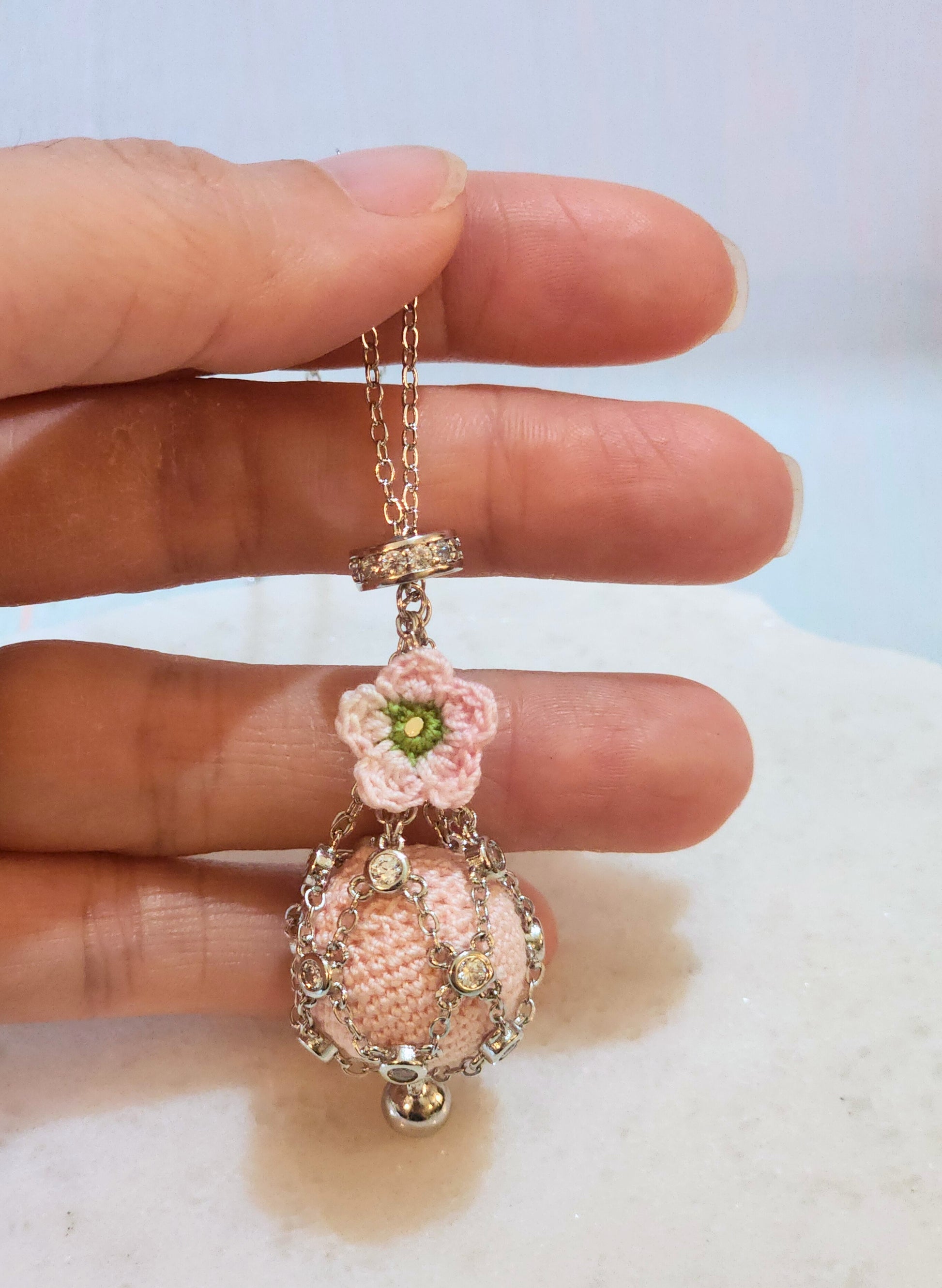 Dreamcatcher necklace with handcrafted micro-crochet pink 'pearl' & apple blossom. S925 sweater chain with cubic zirconia.