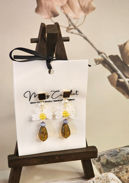 Handcrafted micro-crochet daisies earrings with freshwater pearls & vintage Czech glass beads. Styled with 18K gold-plated findings & studs 