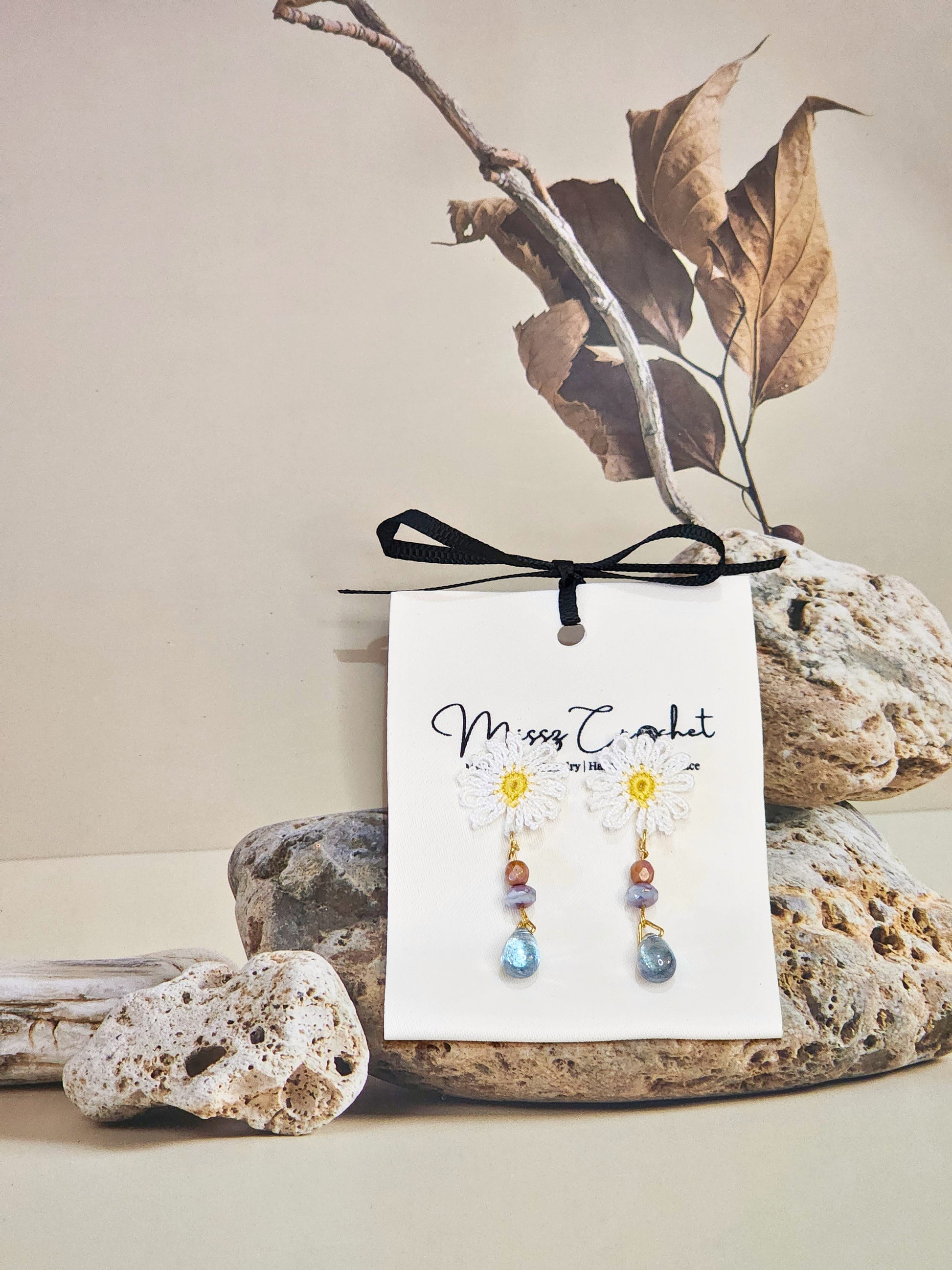 Handcrafted micro-crochet daisies with vintage Czech glass beads. Paired with 18K gold-plated findings & studs.