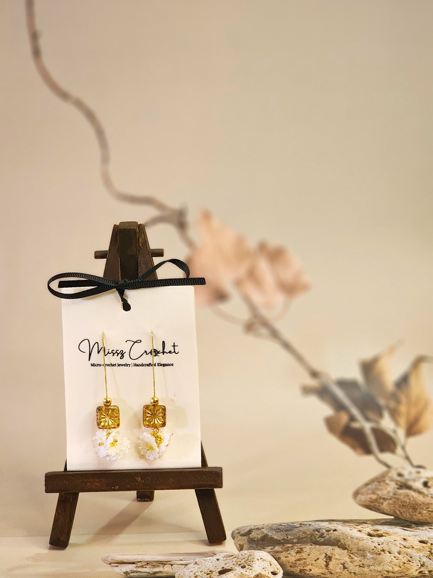 Handcrafted micro-crochet daisies accented with gleaming gold & vintage Czech glass beads. Styled with 18K gold-plated tassel hooks