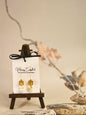 Handcrafted micro-crochet daisies accented with gleaming gold & vintage Czech glass beads. Styled with 18K gold-plated tassel hooks