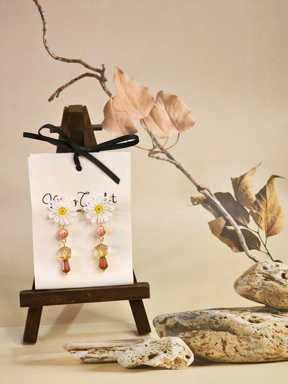 Handcrafted micro-crochet daisies accented with dazzling pink & brown Czech vintage glass beads & crystals. Styled with 18K gold-plated findings & studs