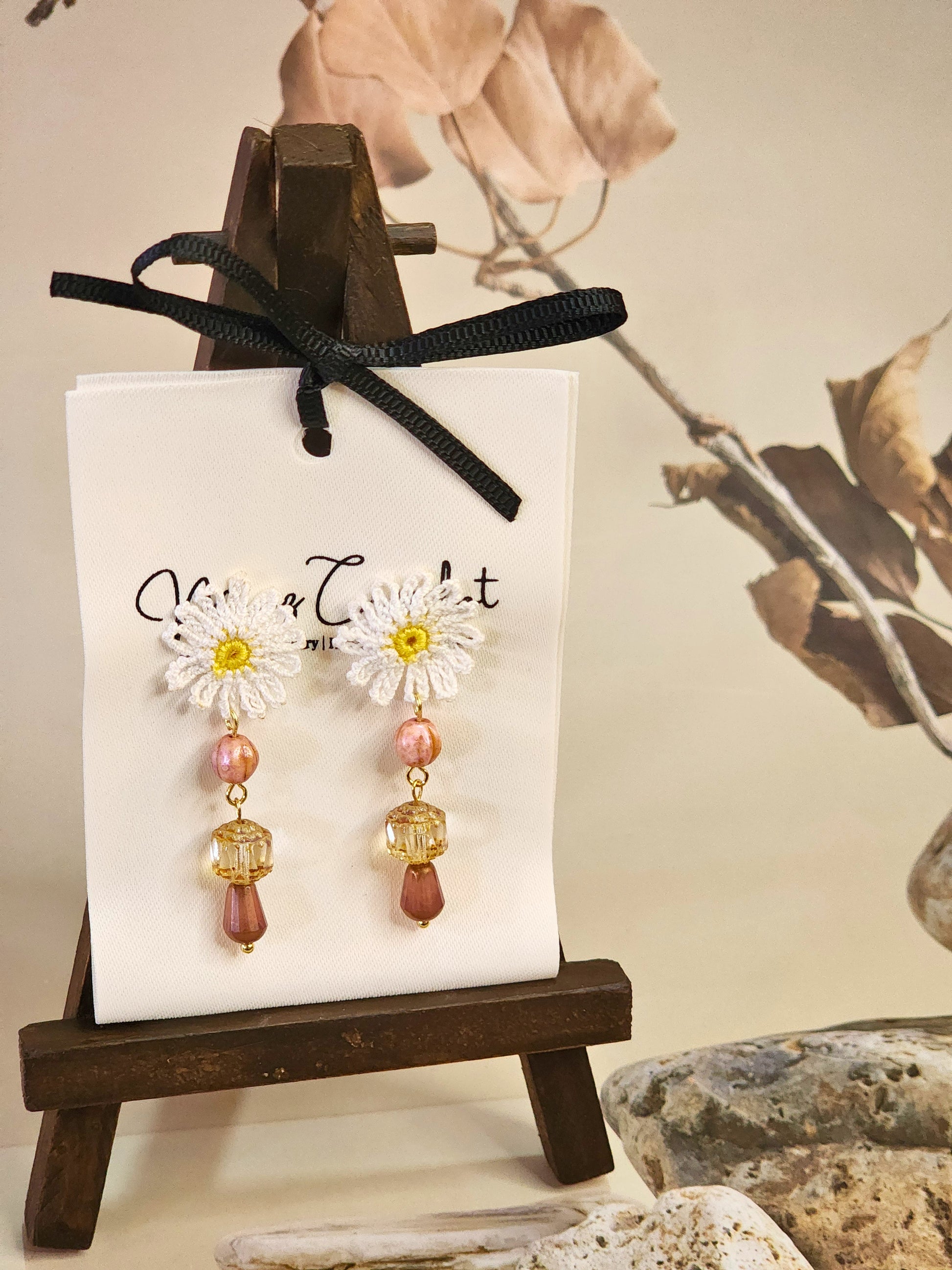Handcrafted micro-crochet daisies accented with dazzling pink & brown Czech vintage glass beads & crystals. Styled with 18K gold-plated findings & studs
