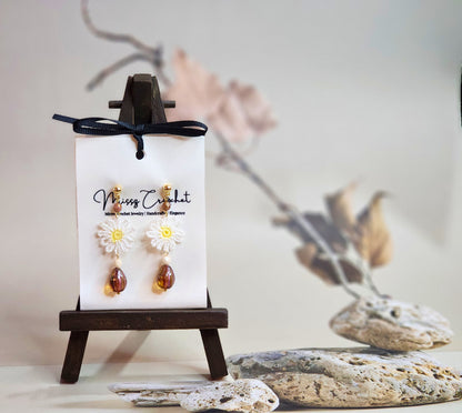Handcrafted micro-crochet daisies accented by vintage Czech glass beads and crystals. Styled with 18K gold-plated findings & studs.