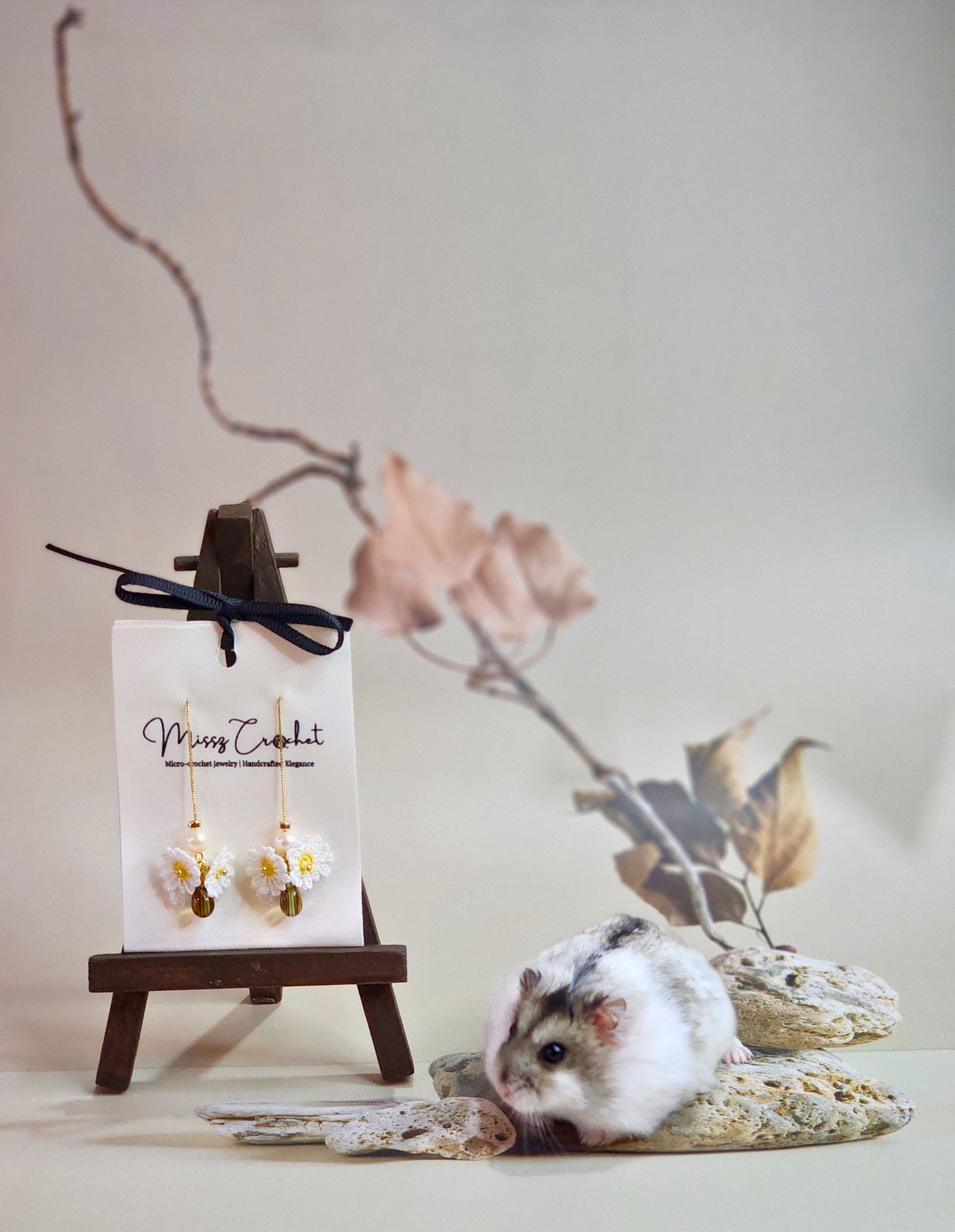 Handcrafted micro-crochet daisies earrings accented with freshwater pearls & vintage glass beads. Styled with 18K gold-plated findings & tassel hooks. 