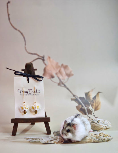 Handcrafted micro-crochet daisies earrings accented with freshwater pearls & vintage glass beads. Styled with 18K gold-plated findings & tassel hooks. 