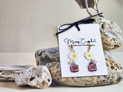 Handcrafted micro-crochet daisies earrings accented with freshwater pearls & vintage Czech glass beads. Styled with 18K gold-plated findings & hooks.