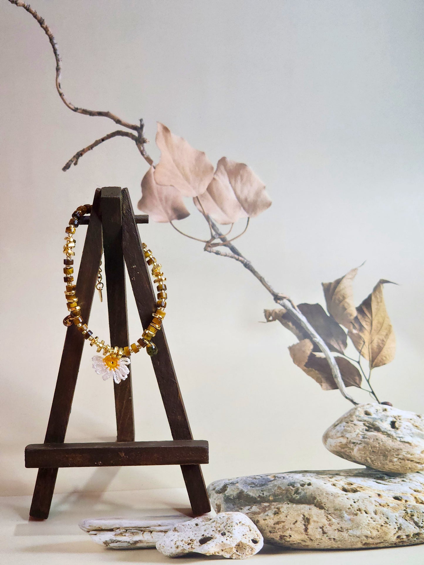 Natural Tiger Eye beaded bracelet with micro-crochet daisy. Paired with gold-plated spacer beads and vintage Czech glass beads. 18K gold-plated clasp. 