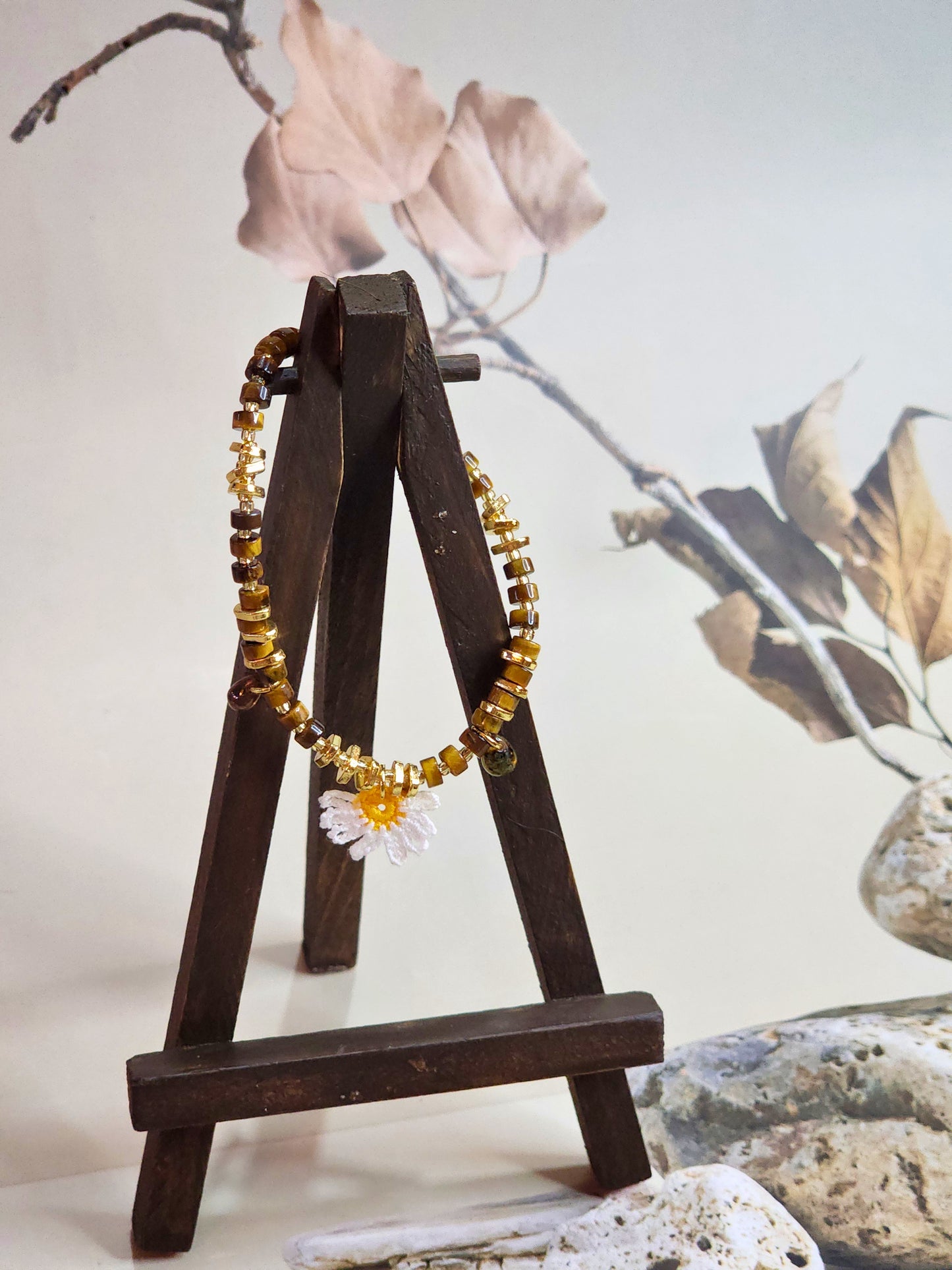 Natural Tiger Eye beaded bracelet with micro-crochet daisy. Paired with gold-plated spacer beads and vintage Czech glass beads. 18K gold-plated clasp. 