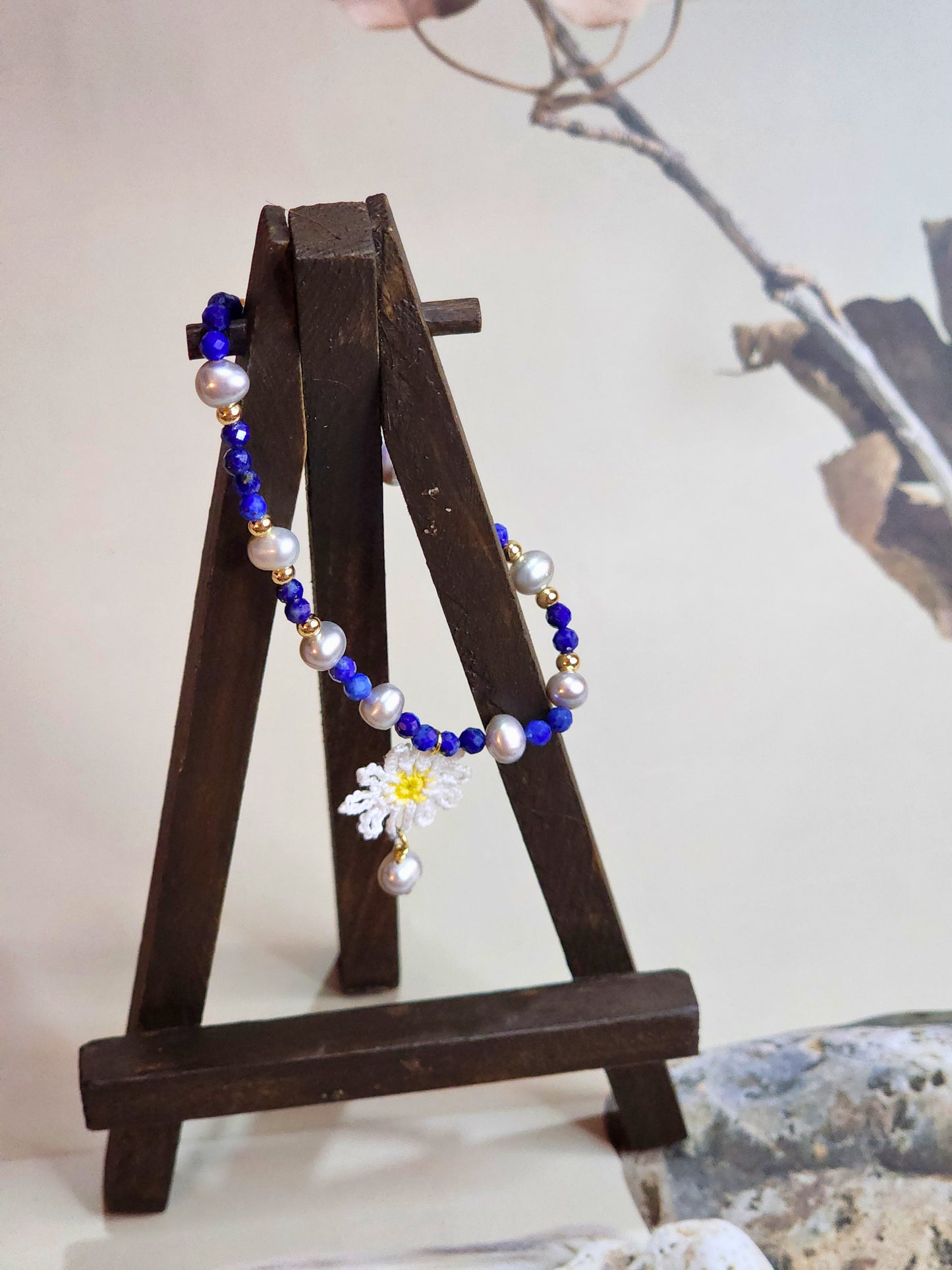 Handcrafted Lapis Lazuli beaded bracelet with Baroque pearls & gold spacer beads. Styled with 18K gold-plated clasp. 