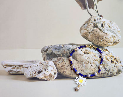 Handcrafted Lapis Lazuli beaded bracelet with Baroque pearls & gold spacer beads. Styled with 18K gold-plated clasp. 
