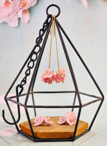 Two pairs of Sakura micro-crochet tassel earrings in varying shades of pink and adorned with premium crystals