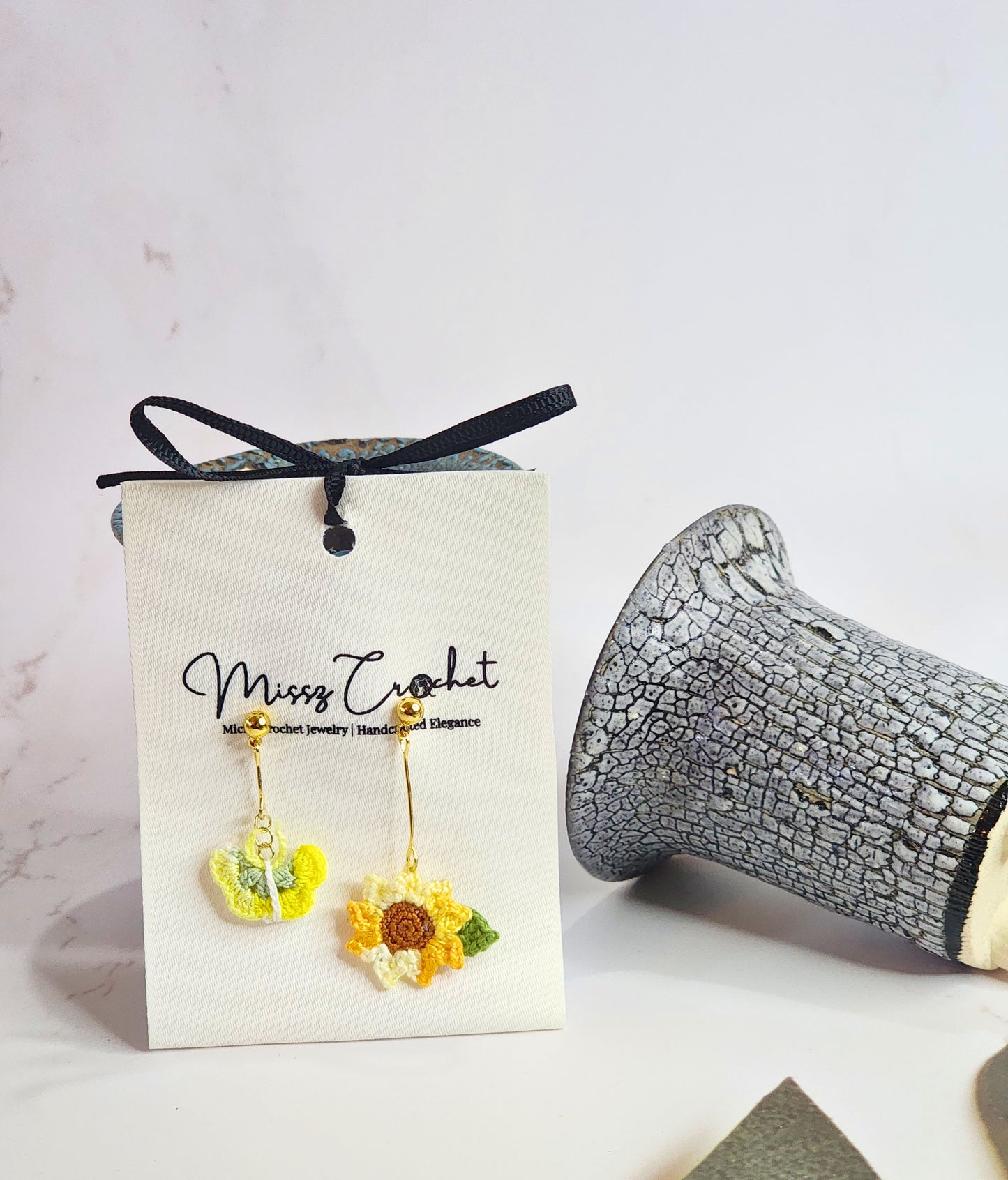 Handcrafted micro-crochet sunflower & butterfly asymmetrical earrings. 18K gold-plated findings & studs.