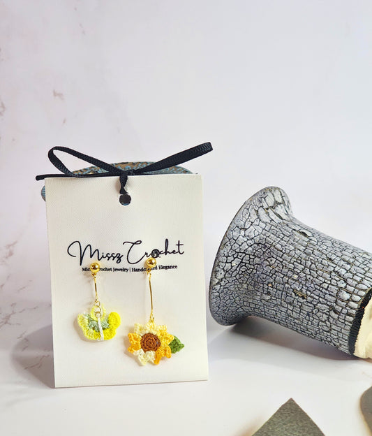 Handcrafted micro-crochet sunflower & butterfly asymmetrical earrings. 18K gold-plated findings & studs.