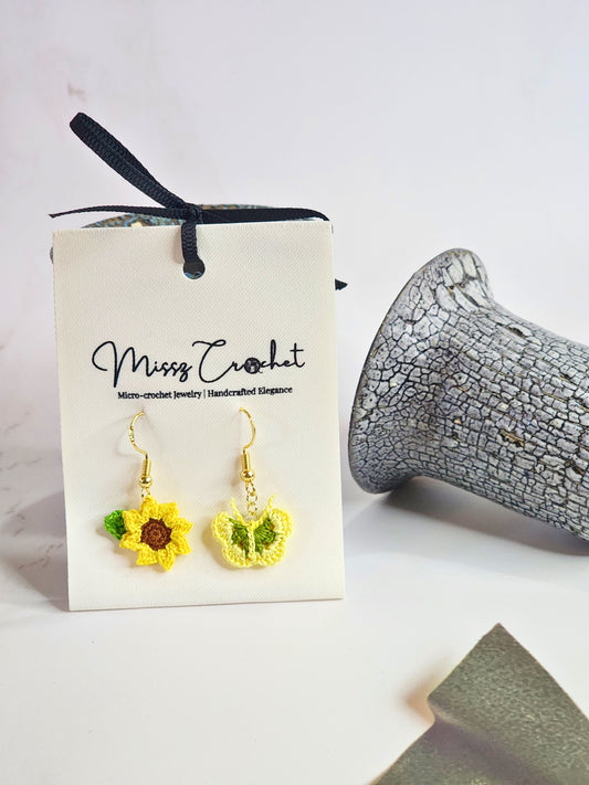Handcrafted micro‑crochet Sunflower & Butterfly dangling earrings. Set on 18K gold-plated hooks.