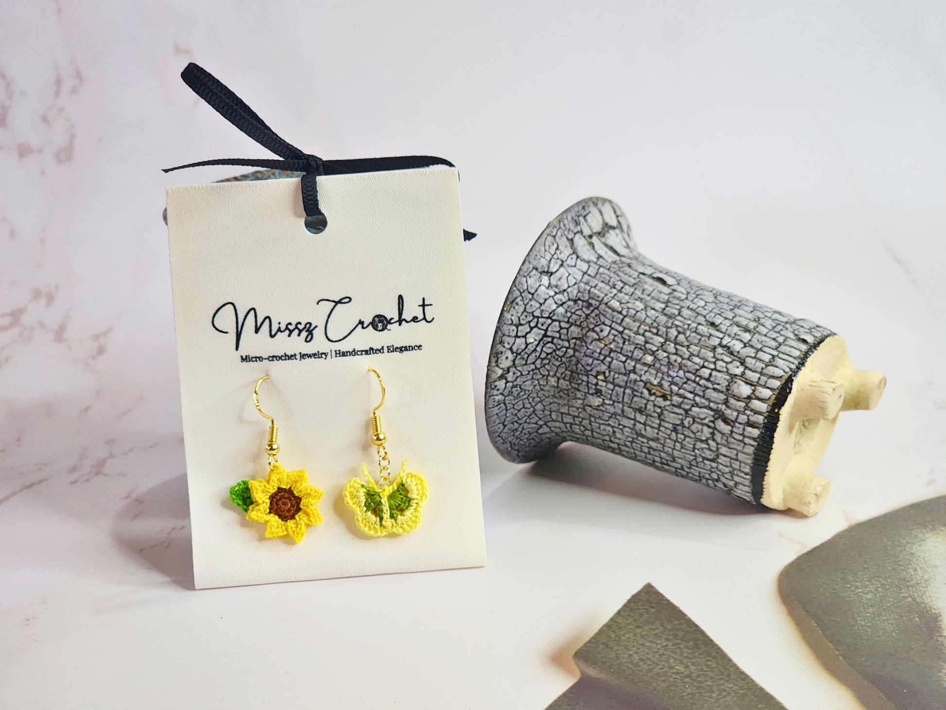 Handcrafted micro‑crochet Sunflower & Butterfly dangling earrings. Set on 18K gold-plated hooks.
