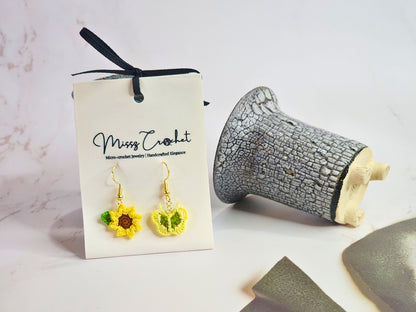 Handcrafted micro‑crochet Sunflower & Butterfly dangling earrings. Set on 18K gold-plated hooks.