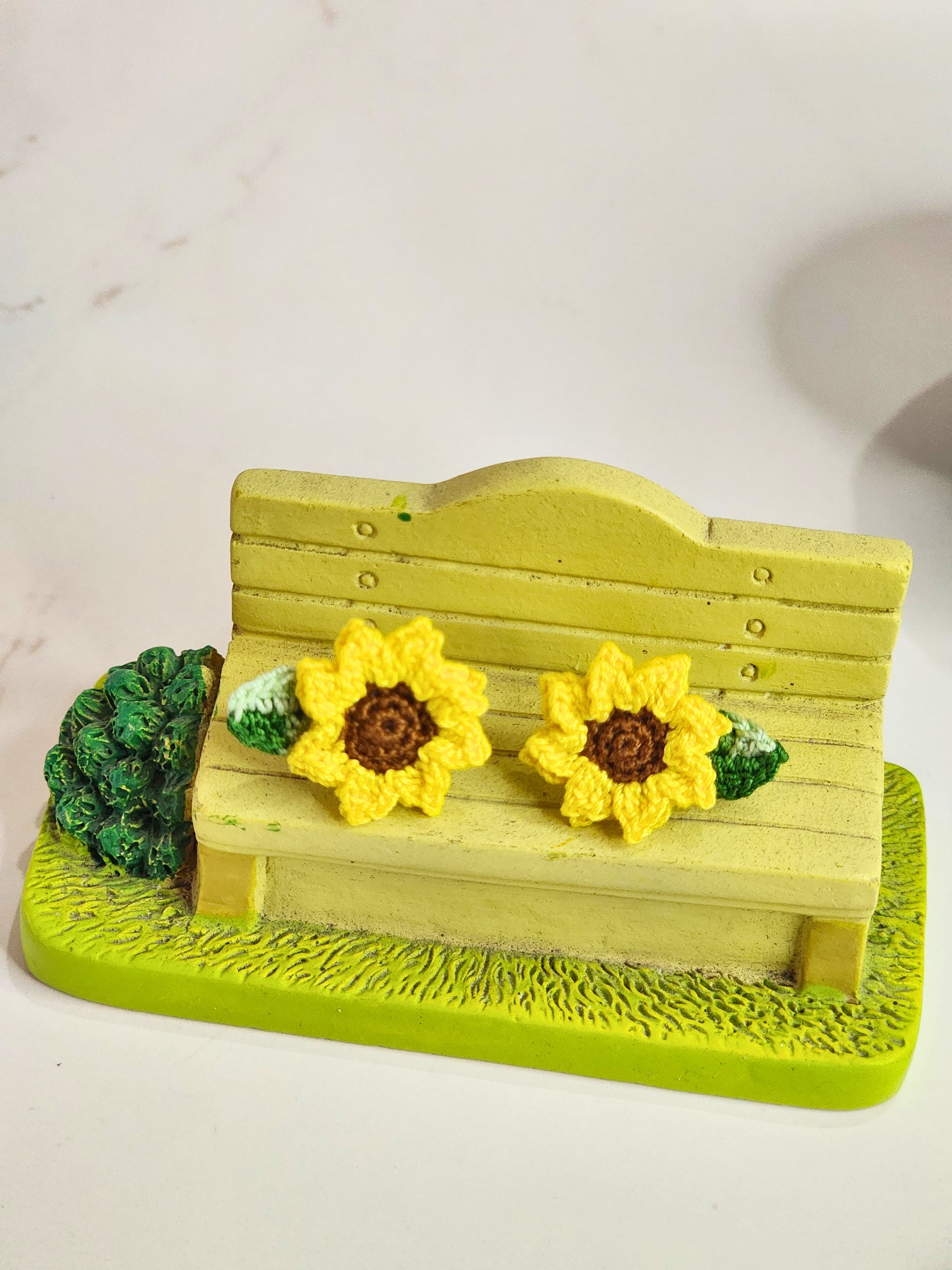 Handcrafted micro‑crochet Sunflower with Ombre Leaves earrings. Vibrant yellow matched with ombre green leaves. 18K gold-plated studs.