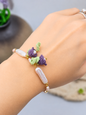 Handcrafted micro crochet Lily of the Valley blooms bracelet with beautifully satin-like >15mm white Pipa pearls and 4-5mm freshwater baroque pearls. 