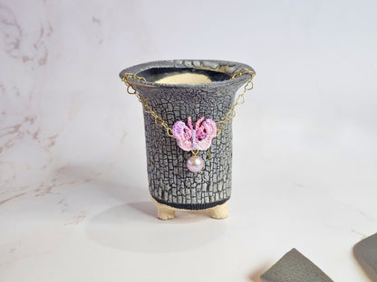 Handcrafted micro-crochet butterfly with 8mm purple freshwater pearl, set on 14K gold-filled heart-shaped bracelet.