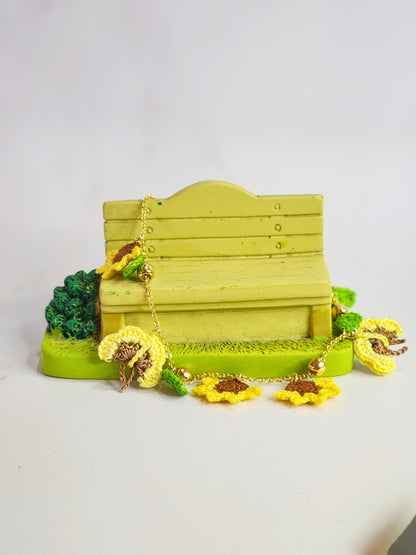 Handcrafted micro-crochet sunflowers & butterflies bracelet. 18K gold-plated adjustable chain.