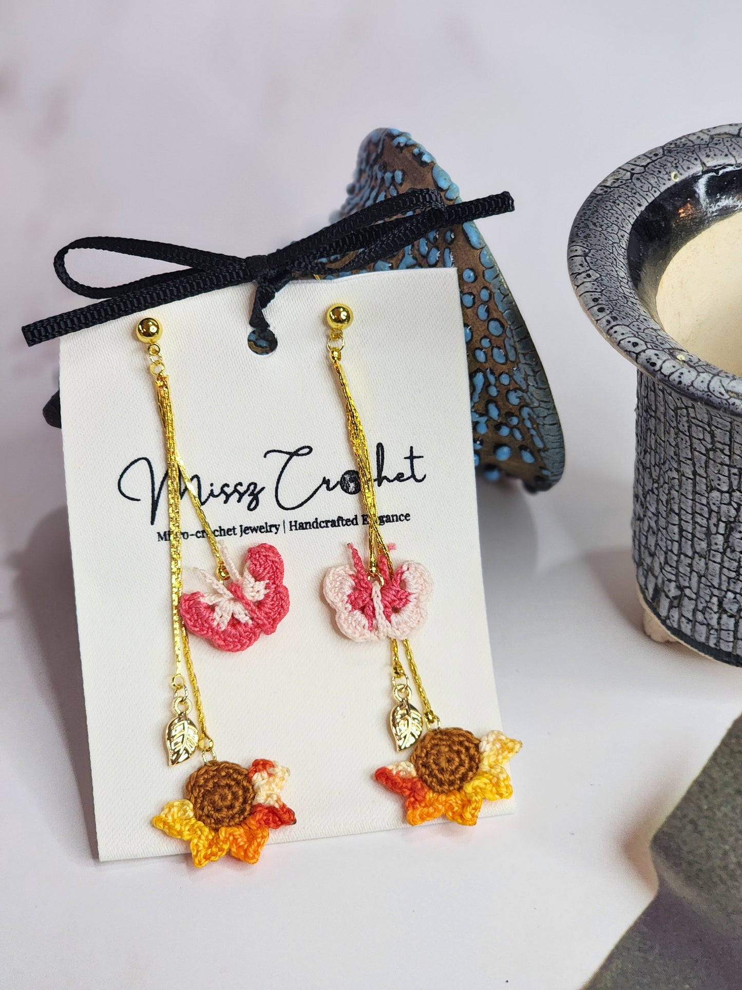 Handcrafted micro-crochet butterflies & sunflower chandelier earrings. 18K gold-plated findings and hooks. 