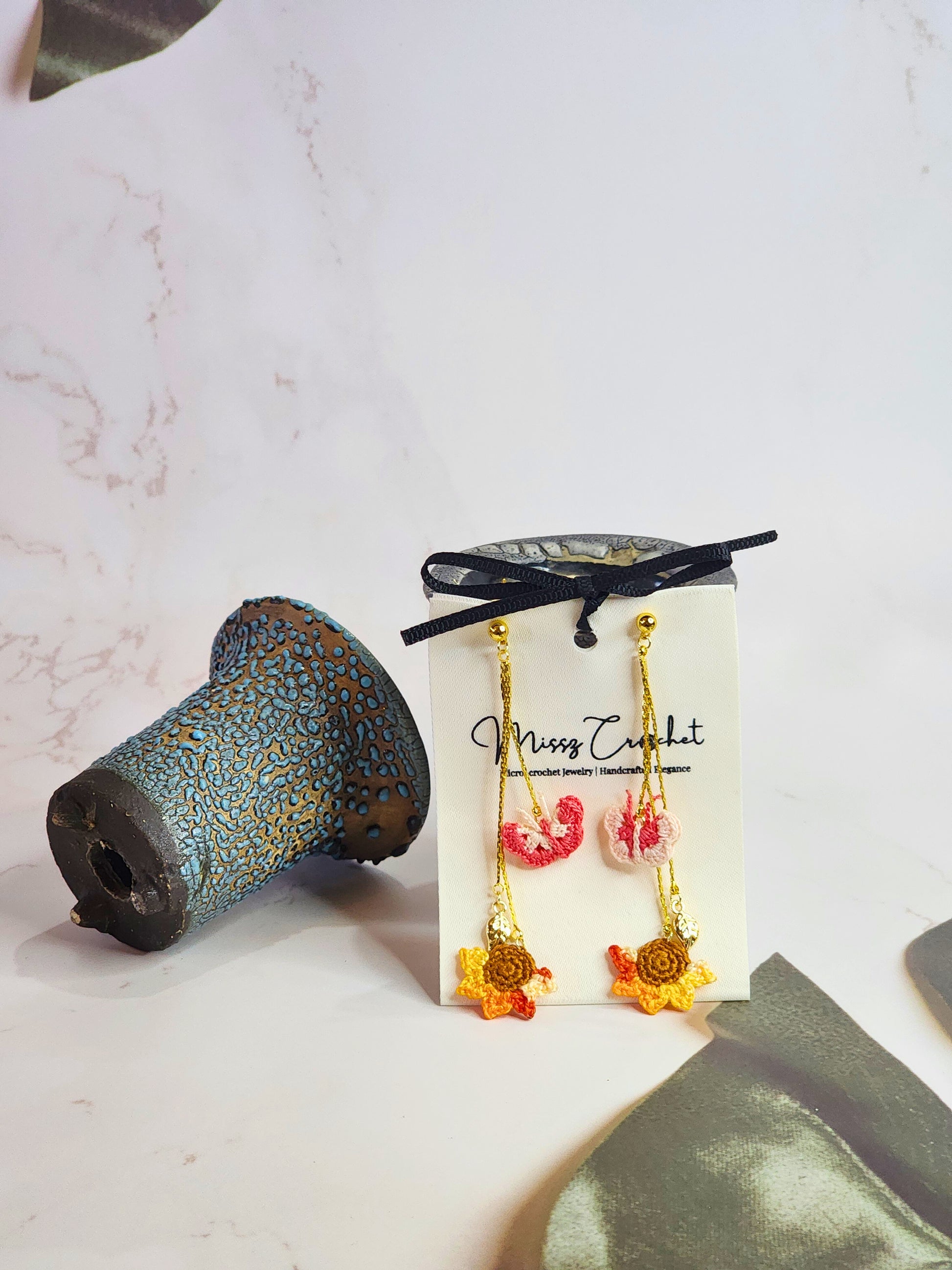 Handcrafted micro-crochet butterflies & sunflower chandelier earrings. 18K gold-plated findings and hooks. 