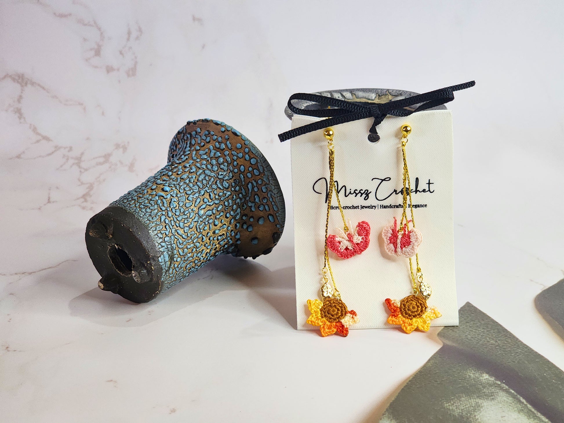 Handcrafted micro-crochet butterflies & sunflower chandelier earrings. 18K gold-plated findings and hooks. 