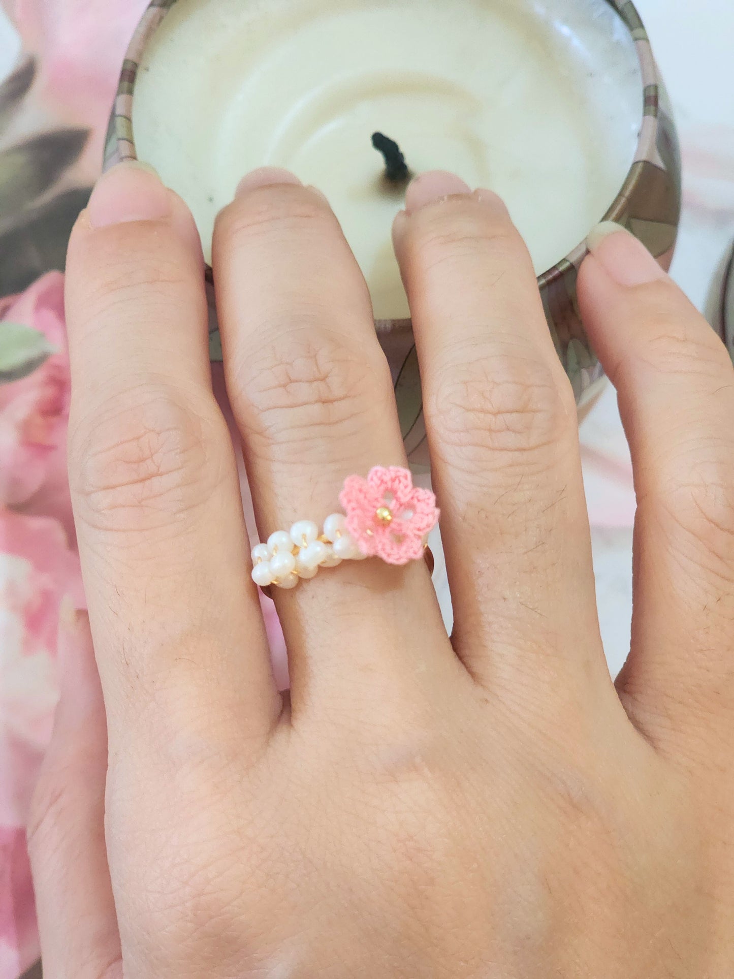 Band of pearls with handcrafted micro-crochet Sakura ring. Set on 14K gold-plated adjustable ring.