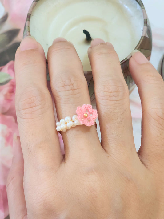 Band of pearls with handcrafted micro-crochet Sakura ring. Set on 14K gold-plated adjustable ring.