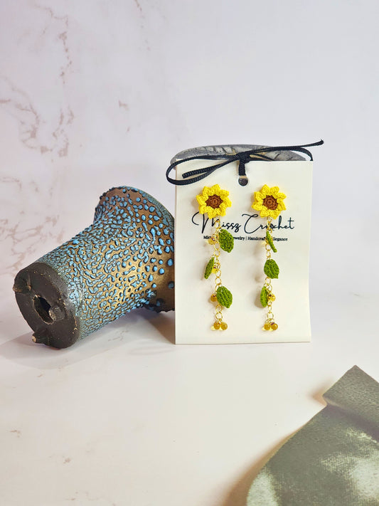 Handcrafted micro-crochet sunflowers and leaves earrings with a cascade of Miyuki waterdrop glass beads from Japan. 18K gold-plated studs.  
