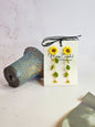 Handcrafted micro-crochet sunflowers and leaves earrings with a cascade of Miyuki waterdrop glass beads from Japan. 18K gold-plated studs.  